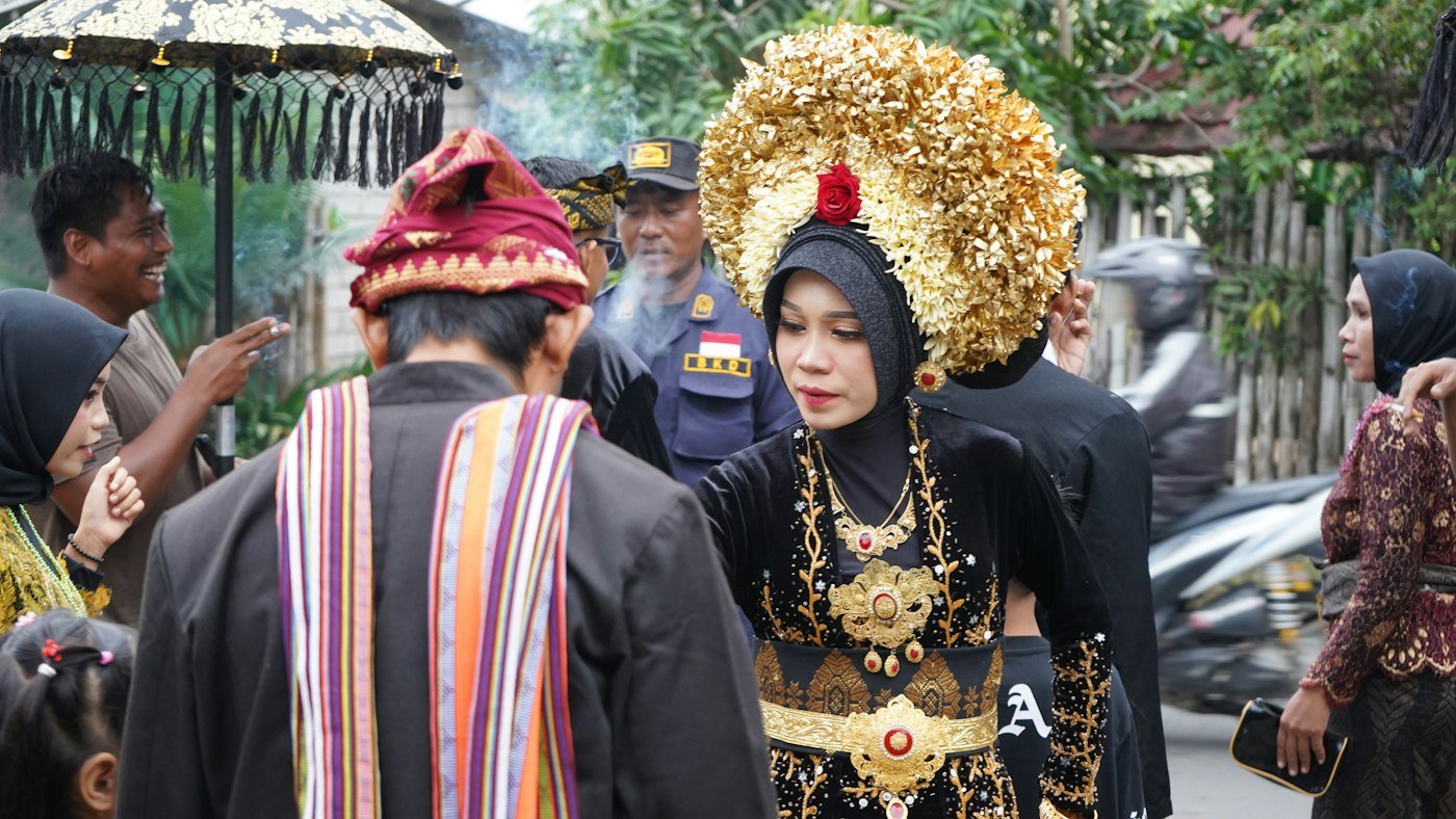 Bride wearing a golden traditional headdress during the ceremony